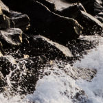 Waves attacking rocks
